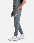 Pantalon New Balance Reimagined Woven - GRIS